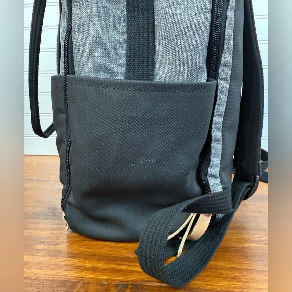Petunia Pickle Bottom gray & black backpack shoulder diaper bag.